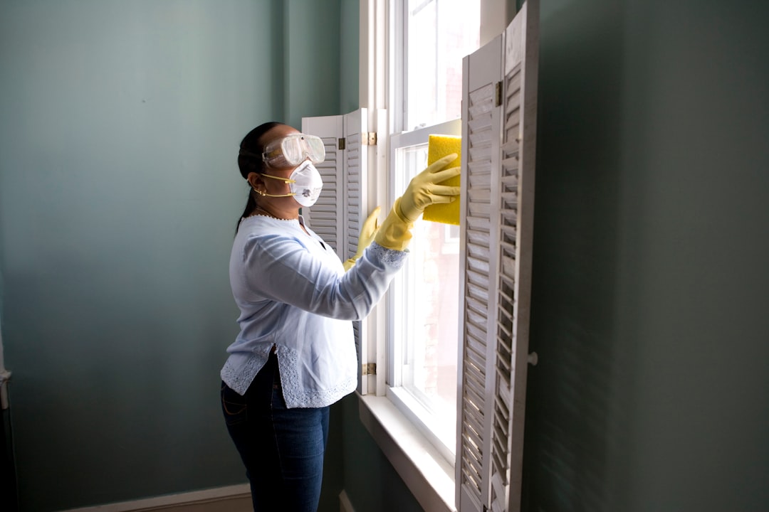 our-mission When renovating a home, you should use a damp sponge or cloth to clean dust collected on a window sill, as the dust may contain asbestos or lead-based paint. Home maintenance is an ongoing process for any homeowner, and here we see an African- American woman who’d taken a damp sponge to her window’s frame, in order to remove accumulated dust particulates. Note how the homeowner had donned a pair of waterproof gloves, a facemask, and a pair of goggles, prior to beginning this task.